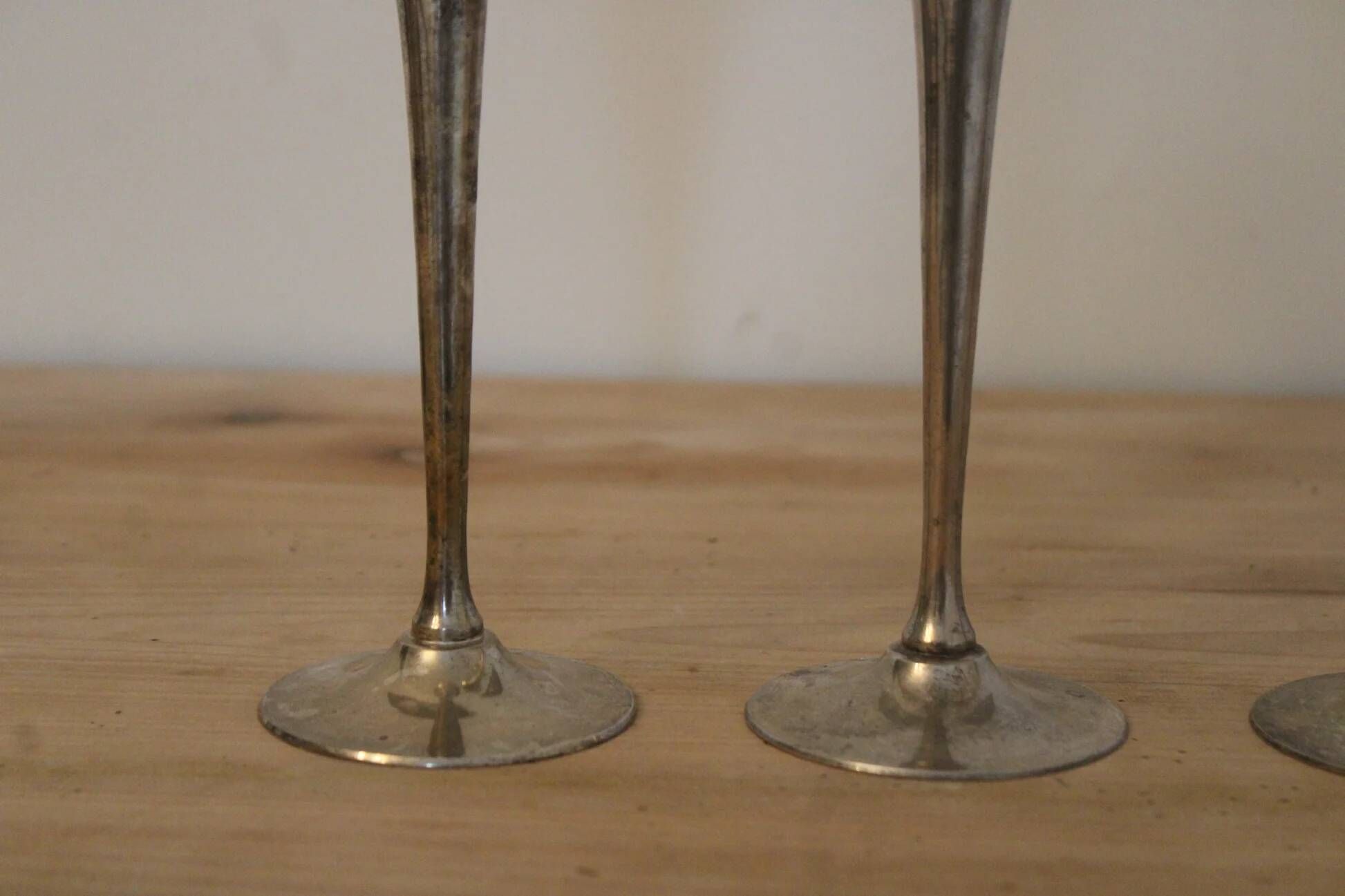 Set of 3 vintage silver-plated and gold footed cups.
