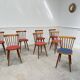 Huit chaises Baumann à assise colorée