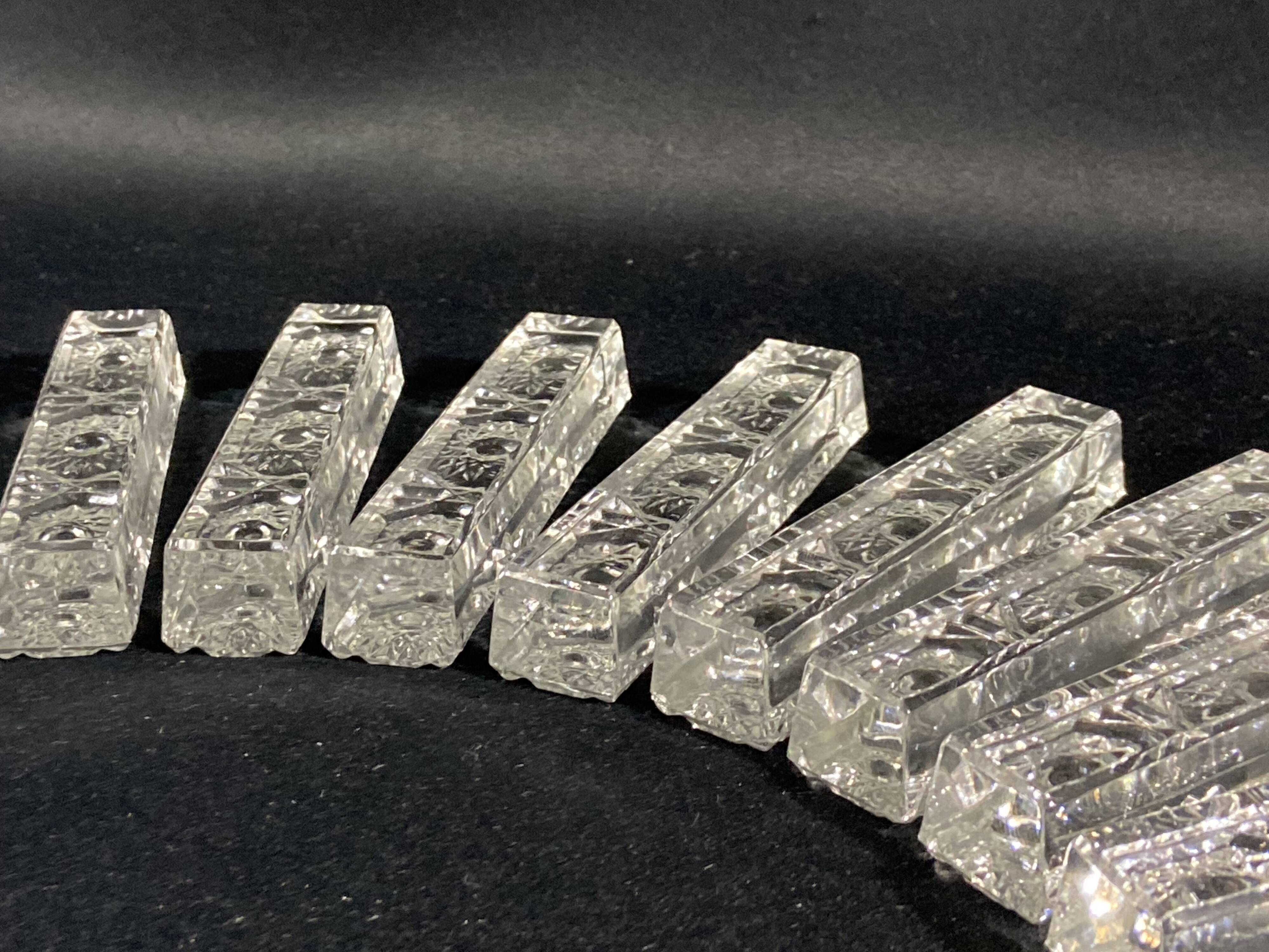 Set of 12 molded glass or crystal knife rests with diamond point decor