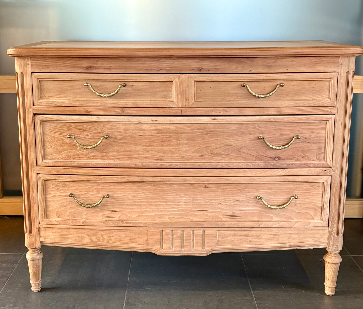 Cherry wood commode with a raw wood finish.