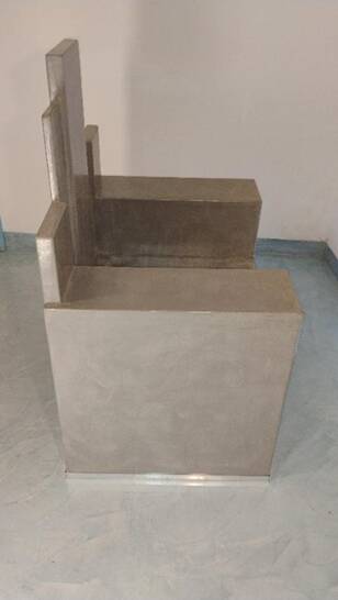 Architectural armchair in polished concrete – Unique artisan piece.