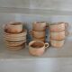 8 tasses anciennes avec soucoupes en grès