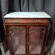 Support display cabinet from the Napoleonic III era in mahogany, gilded bronze, and white marble.