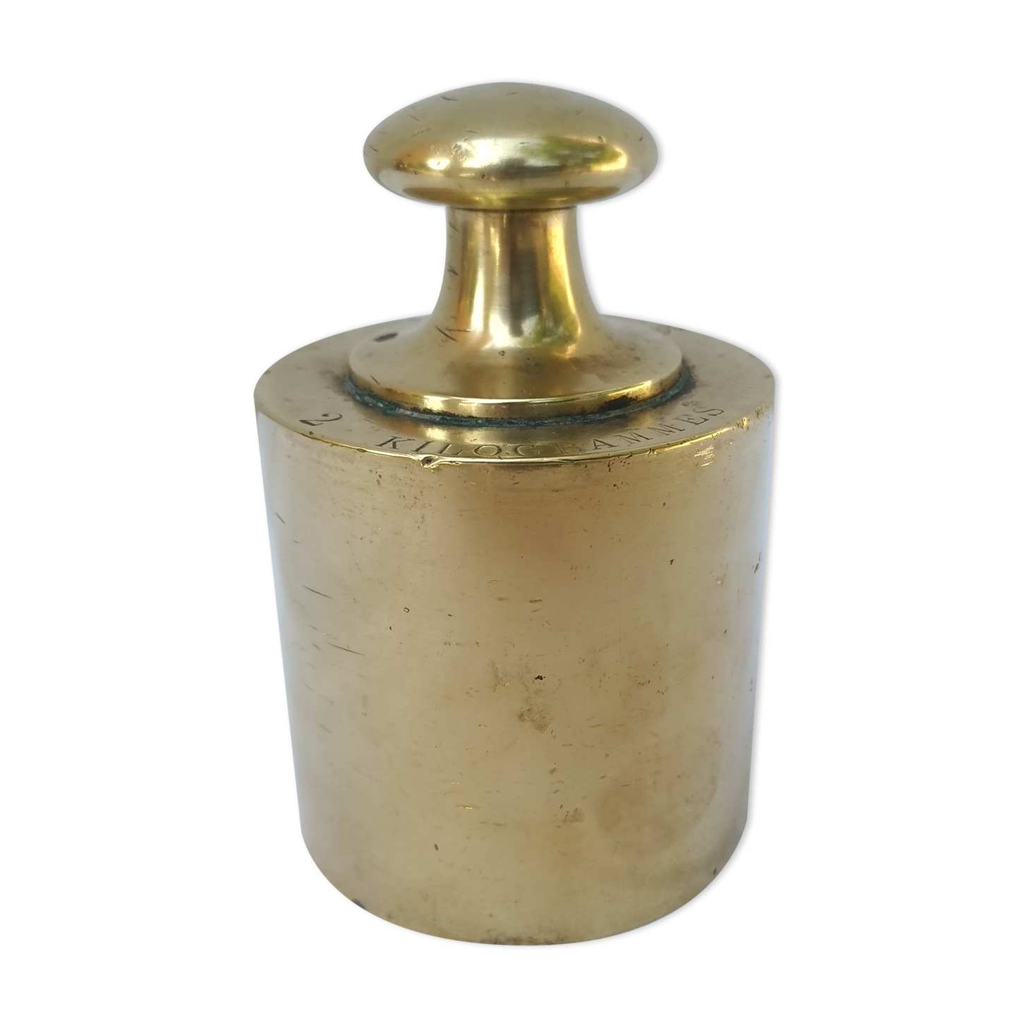 Weight of brass scale of 2 kg