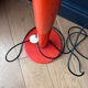1970s orange lacquered metal floor lamp.