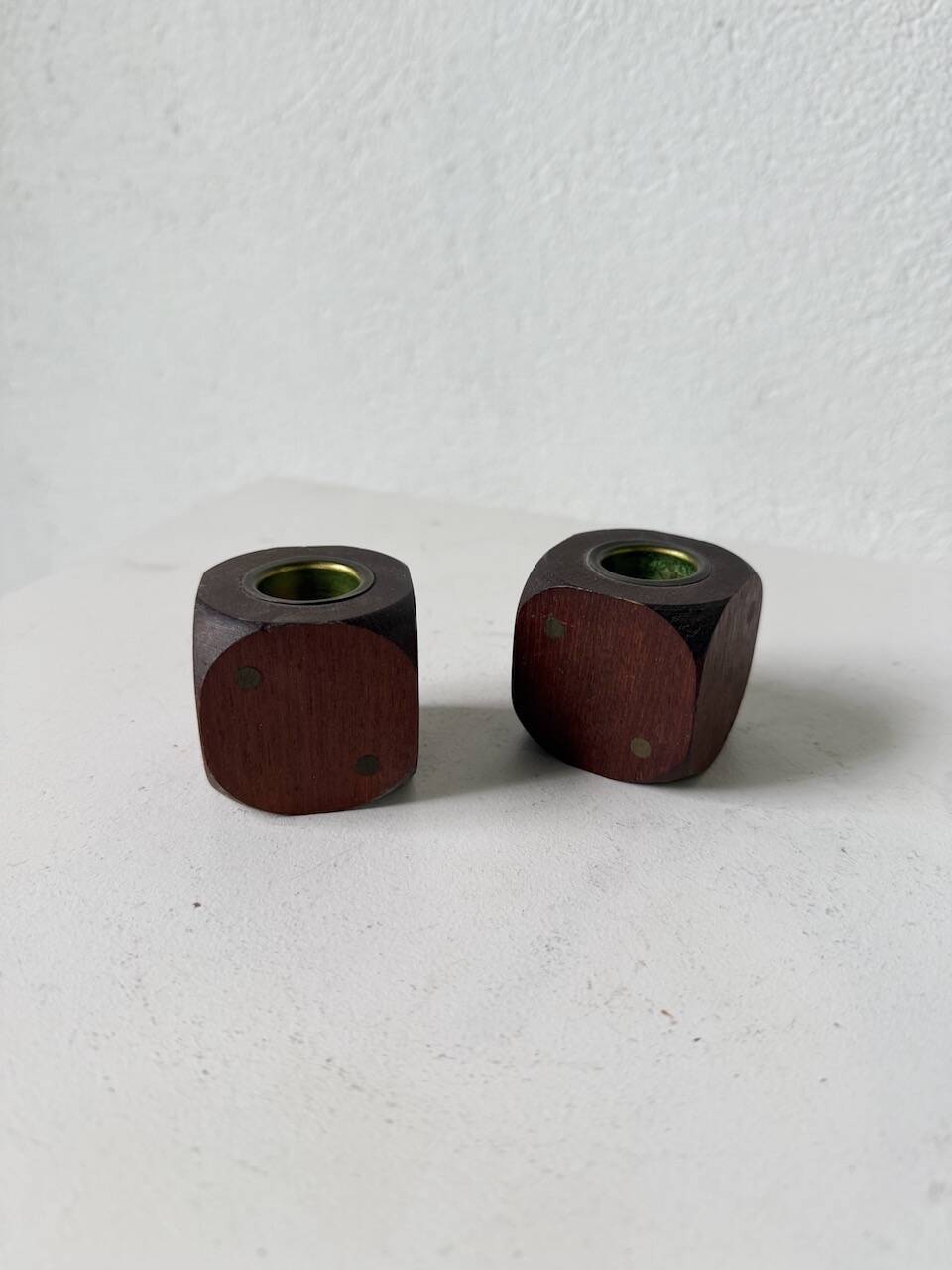 Pair of 1960s teak and brass "dice" candlesticks