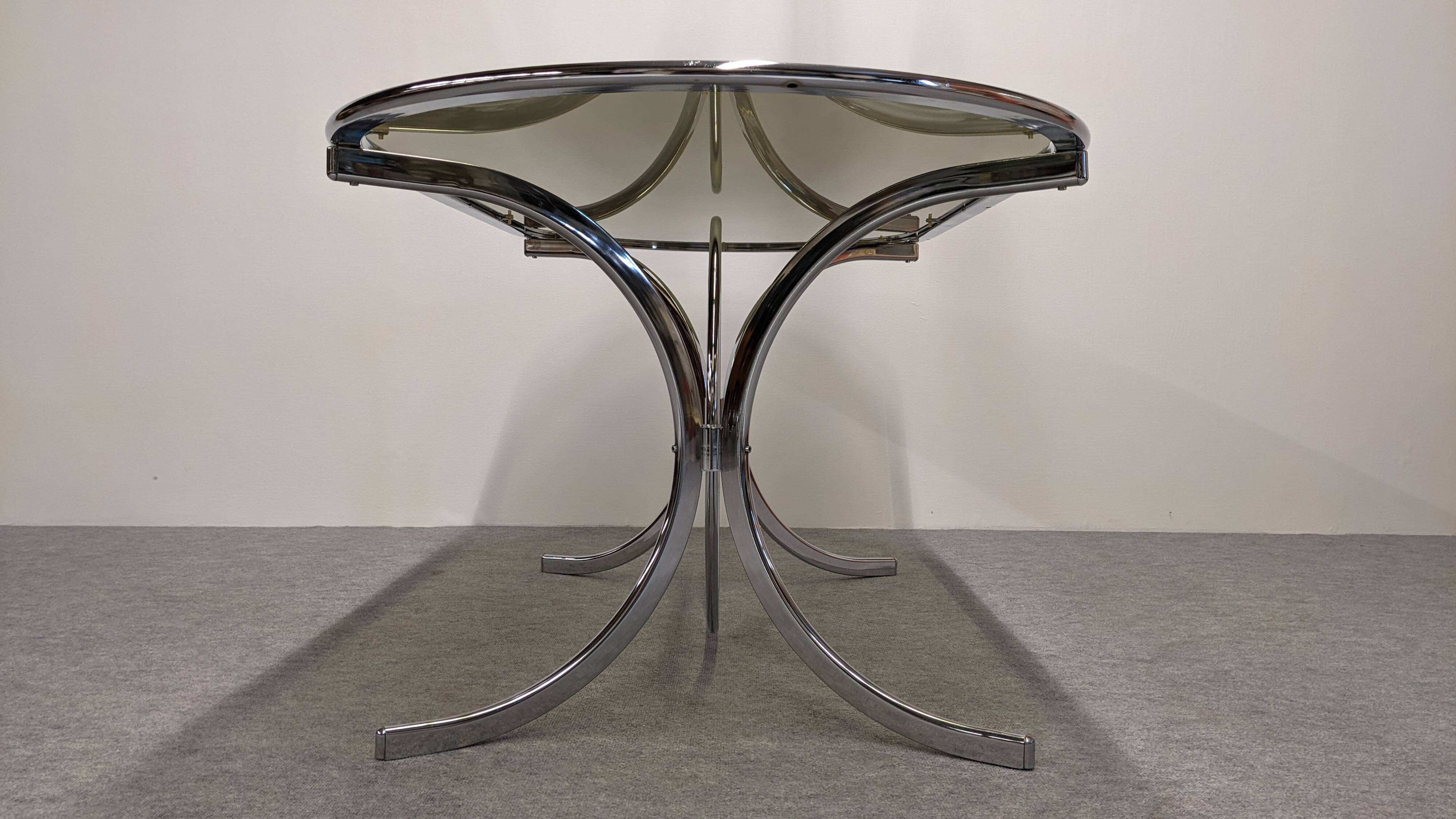 Chrome metal and smoked glass dining table, Italy circa 1970.