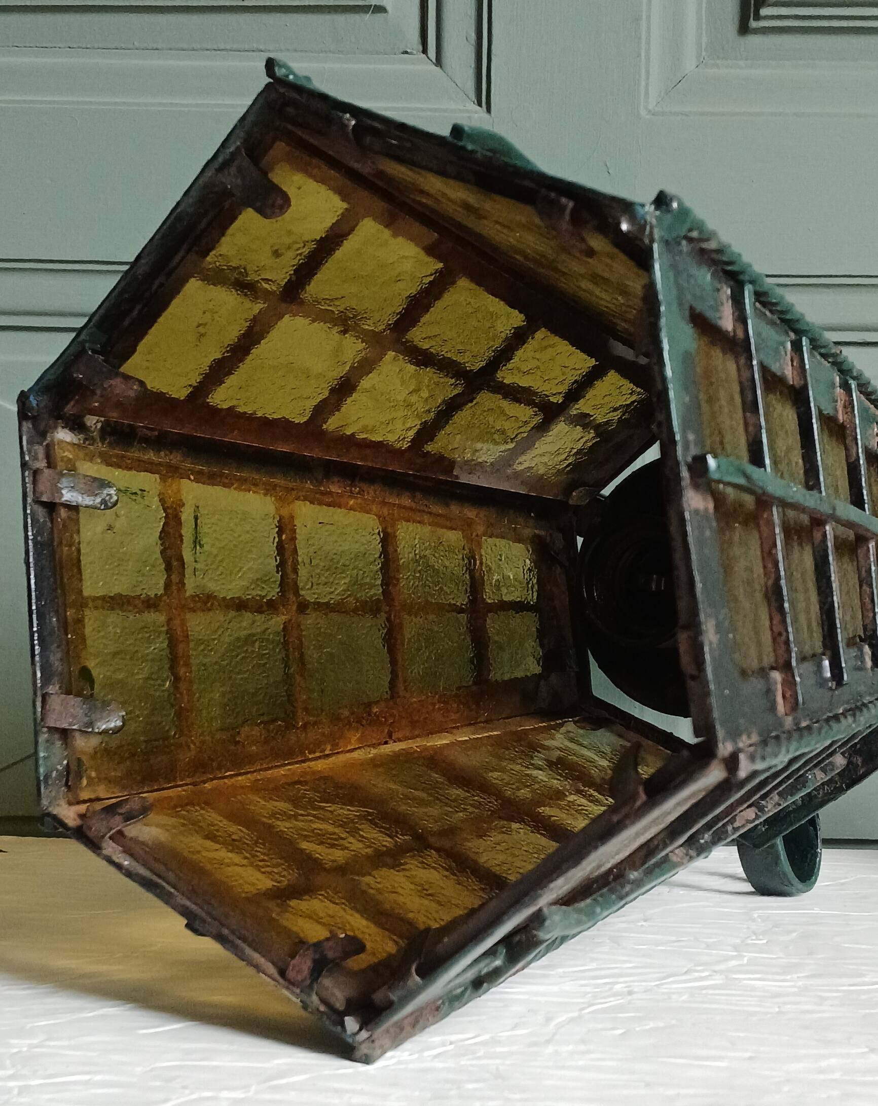 Wrought iron wall lantern & amber cathedral glass