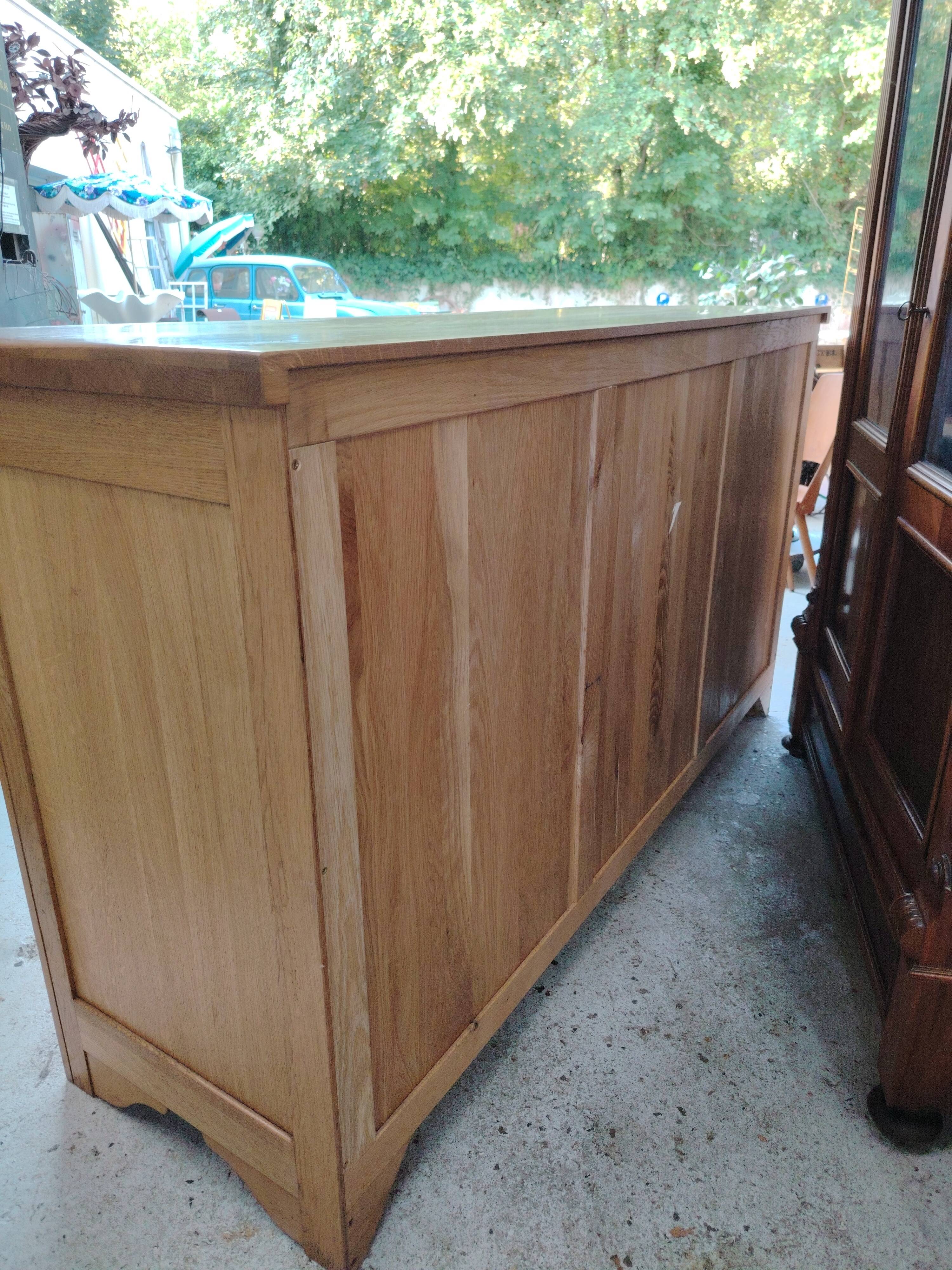 Low sideboard in light solid oak with 3 doors and 1 drawer.
