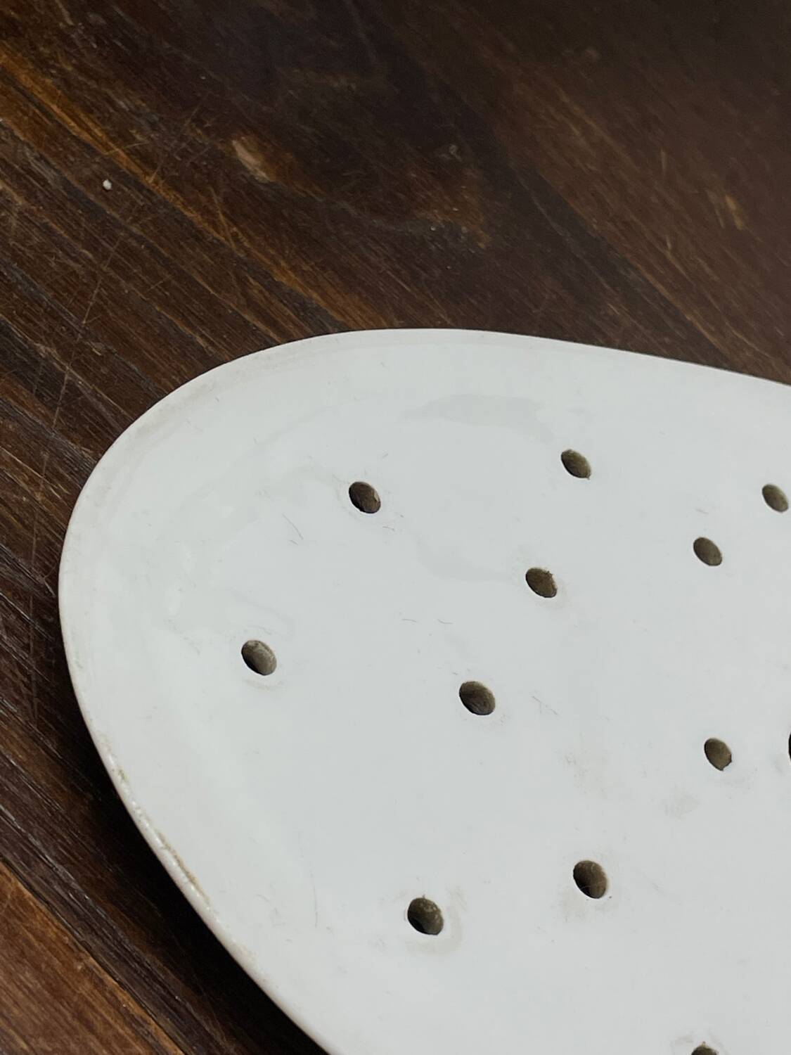 Old iron clay draining plate