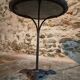 Old French bistro table with a marble top and a cast iron base.