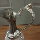Old ewer in crystal and silver metal