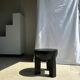Black mango wood tripod side table with a semi-spherical top, height: 45 cm, diameter: 44 cm.
