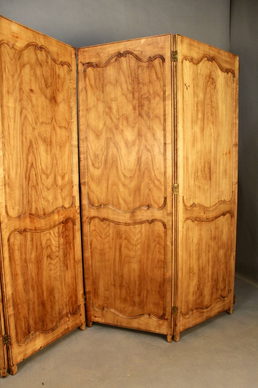 Large cherry wood folding screen with four double-sided panels.