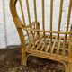 Fauteuil chauffeuse vintage en rotin des années 70
