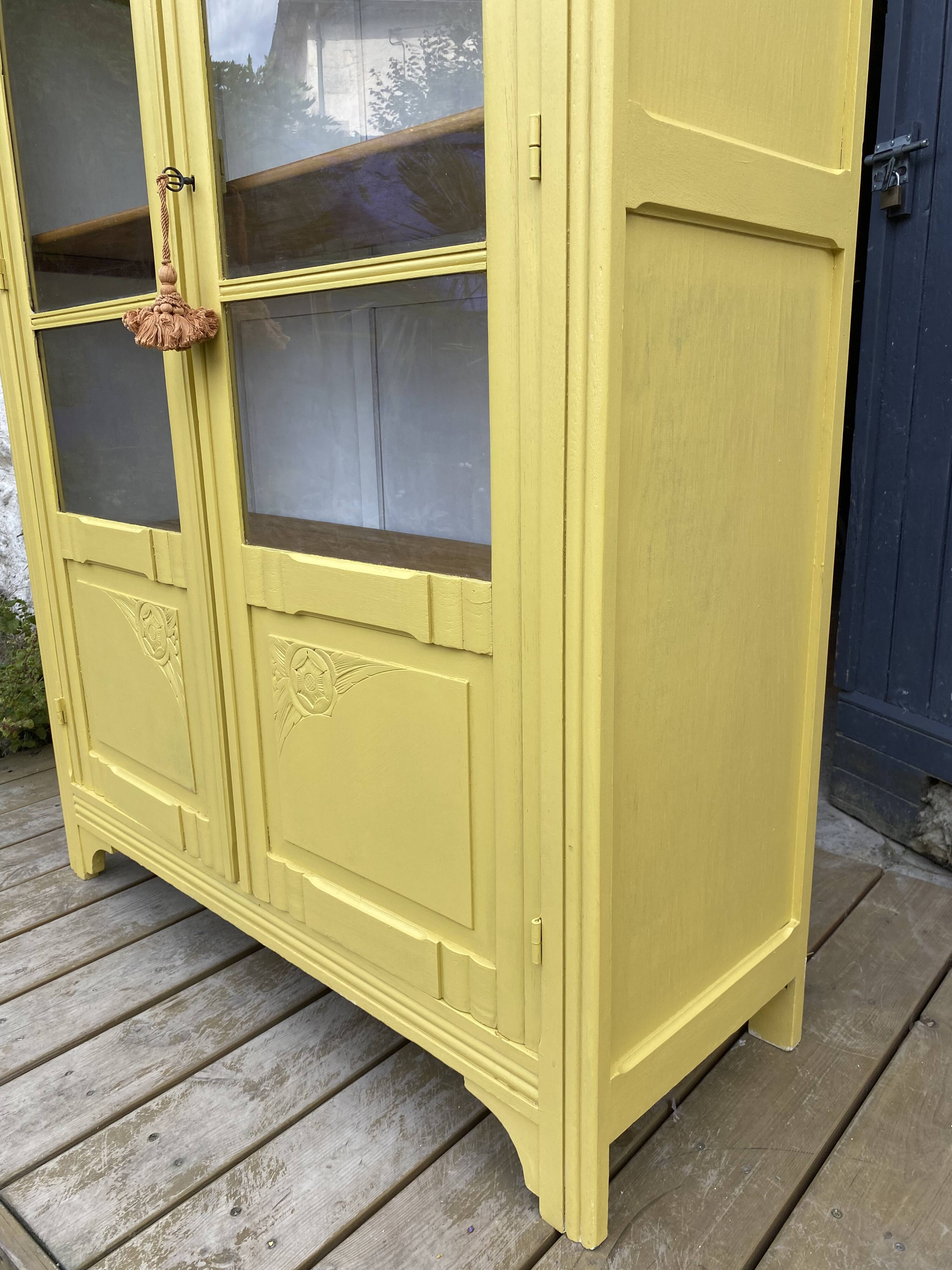 Antique yellow display cabinet