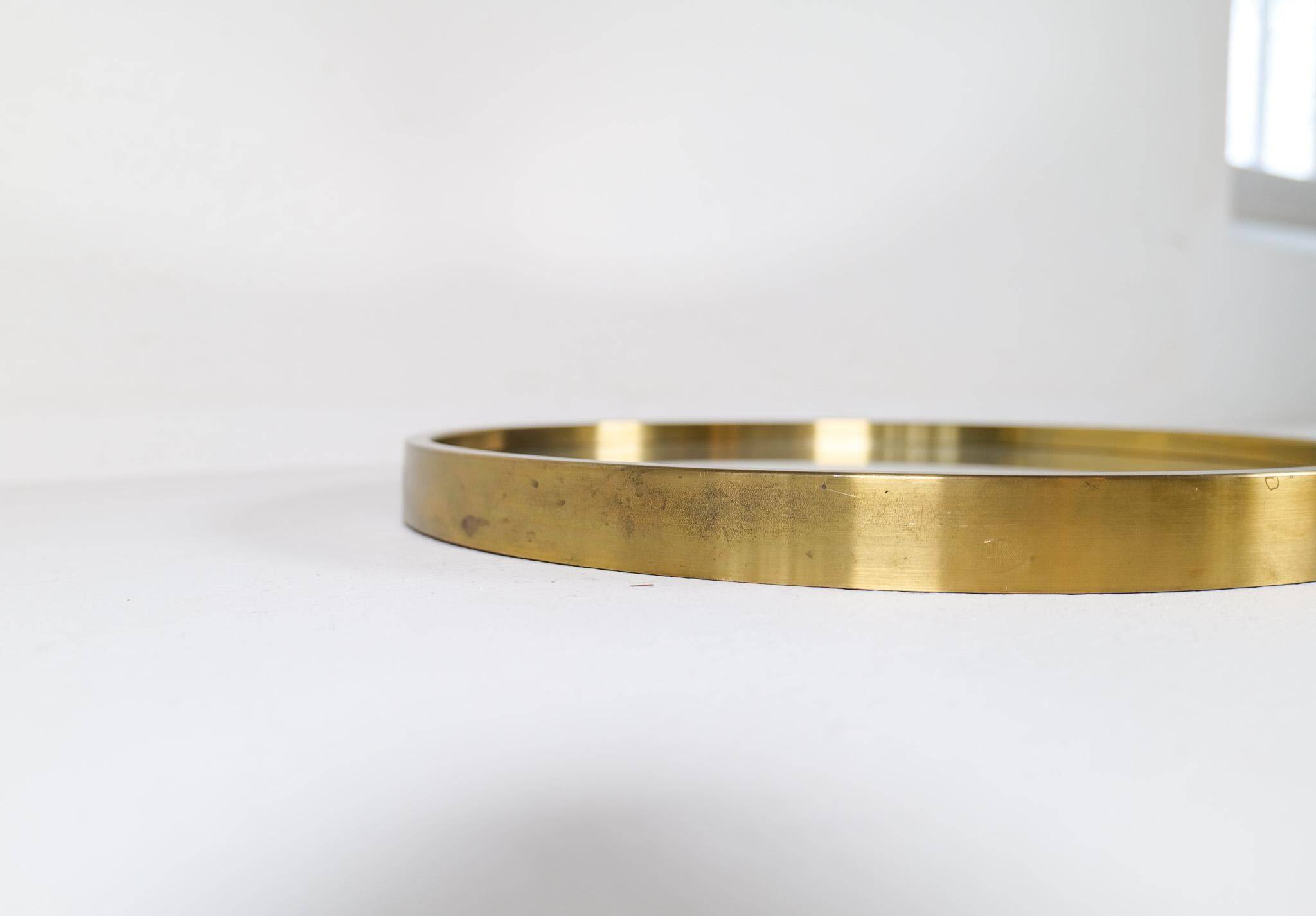 Round brass mirror from the mid-century by Glasmäster in Markaryd, Sweden, 1960s.