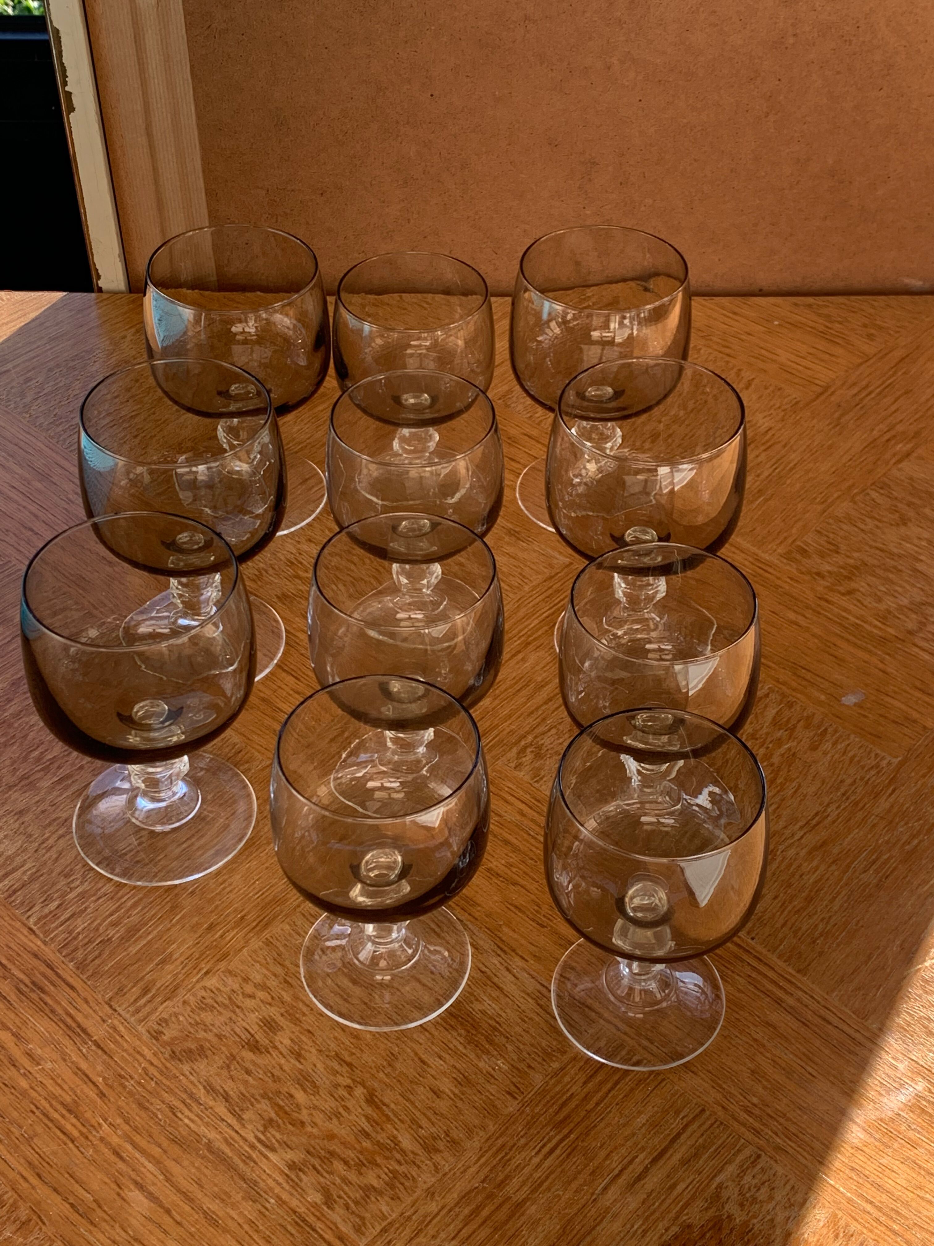 11 wine and water glasses in smoked grey glass and transparent base vintage 1970