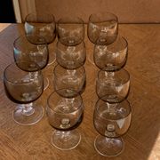 11 wine and water glasses in smoked grey glass and transparent base vintage 1970