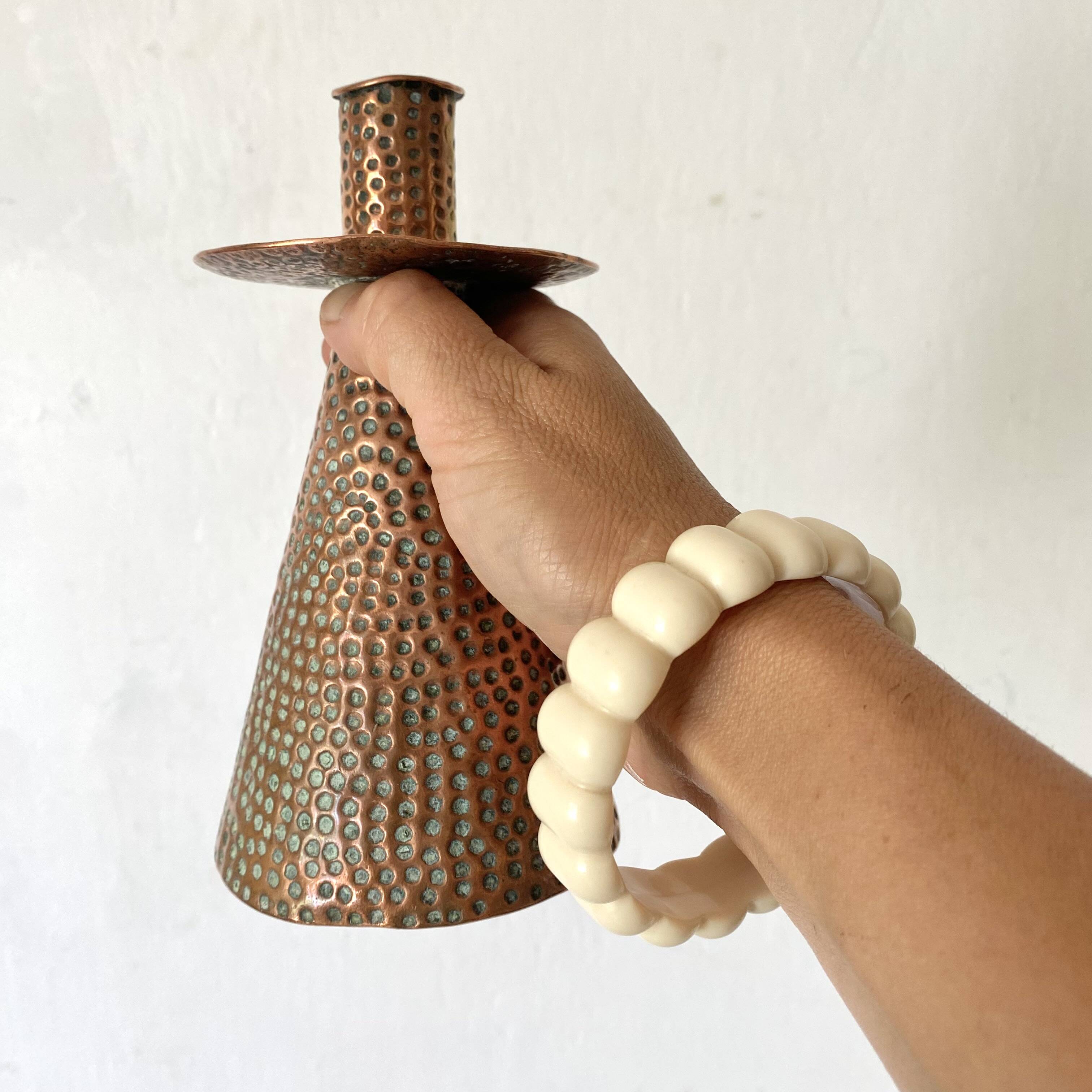 Pair of hammered copper candlesticks from the 1950s