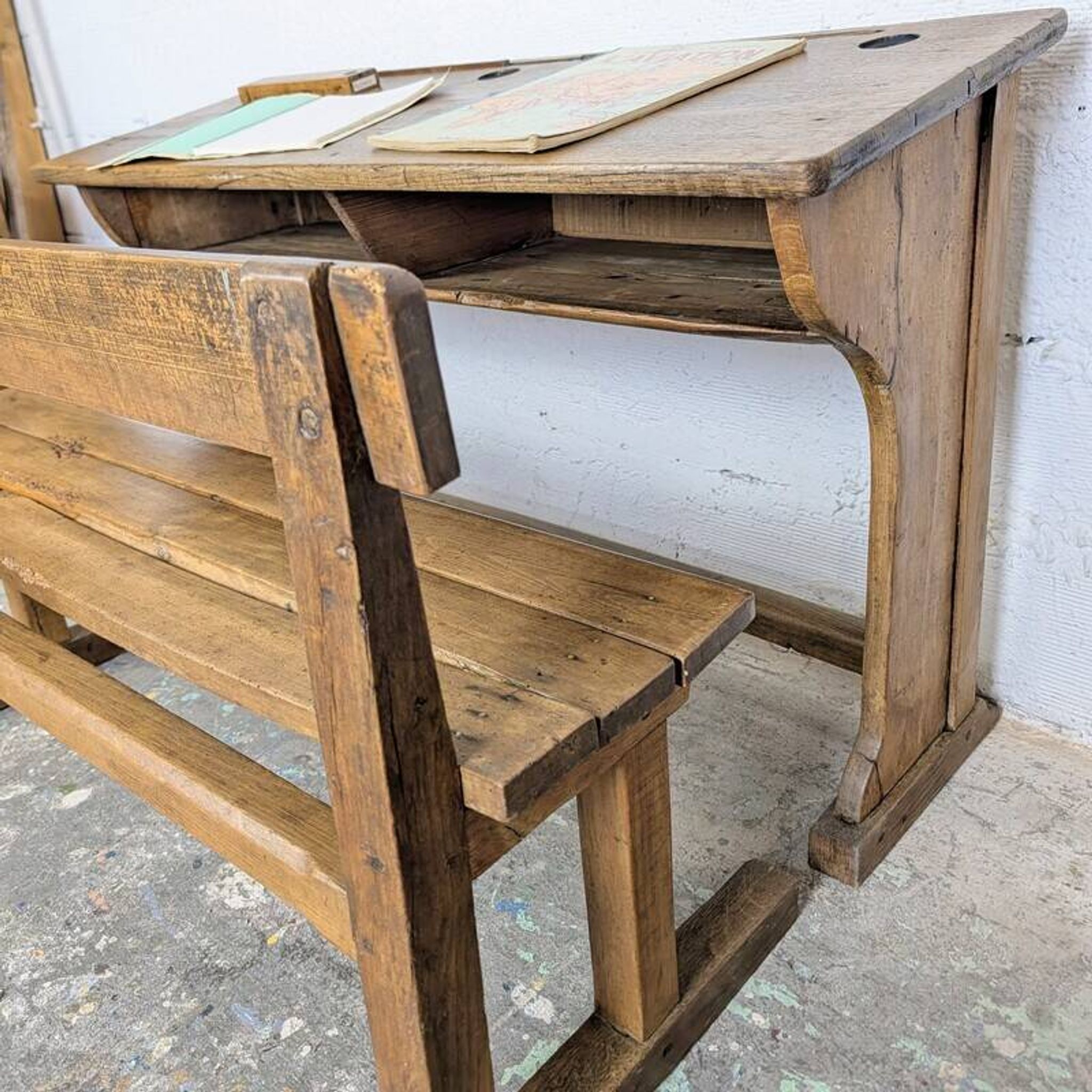 Double school desk and its wooden bench