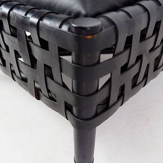 Pair of black woven leather lounge chairs