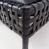 Pair of black woven leather lounge chairs