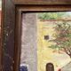 Oil on wood framed by a landscape