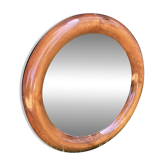 Round varnished wooden mirror