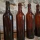 Set of 10 bottles of old Bordeaux French wine in ruby brown glass, 19th century.