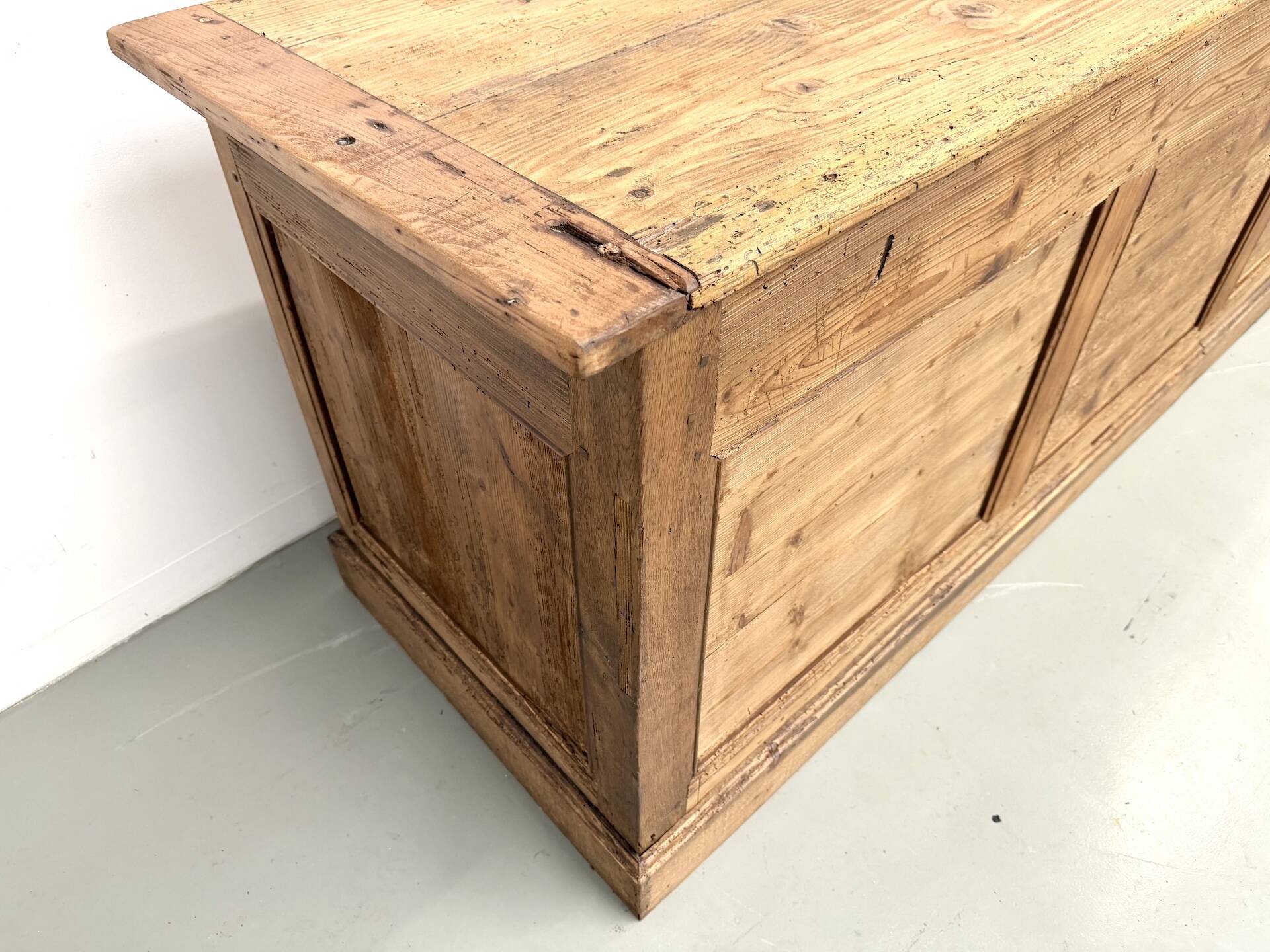 Very large pine trade counter, circa 1920.