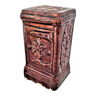 Piggy bank in the shape of a glazed safe decorated in brown color