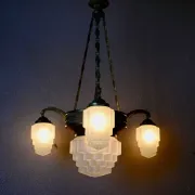 Art Deco lustre in brass and frosted pressed glass from the 1930s.