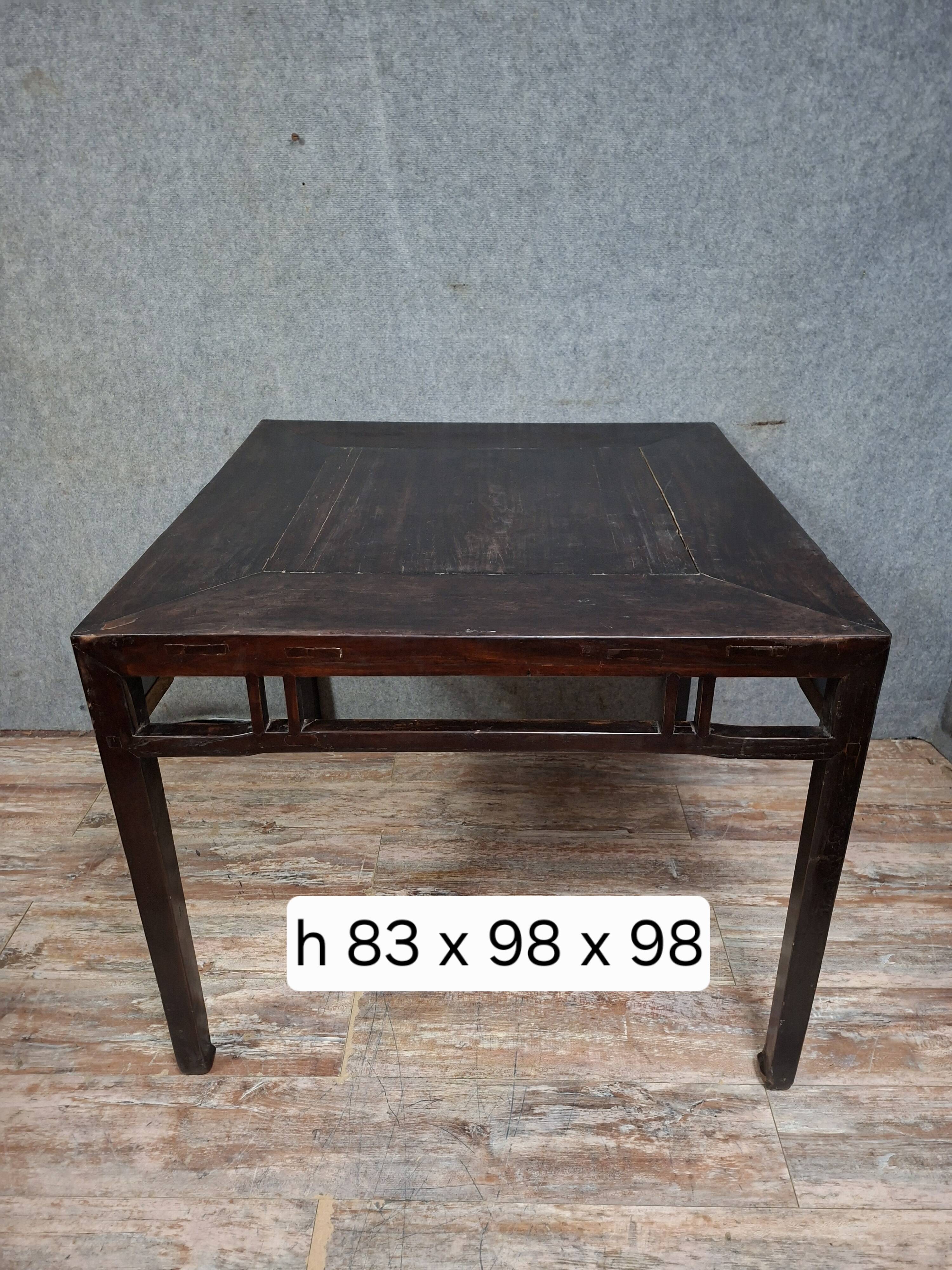 ancient Asian table, made of solid wood with a dark brown patina