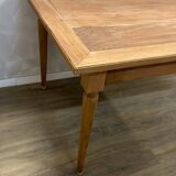 Dining table with tapered legs and solid exotic wood