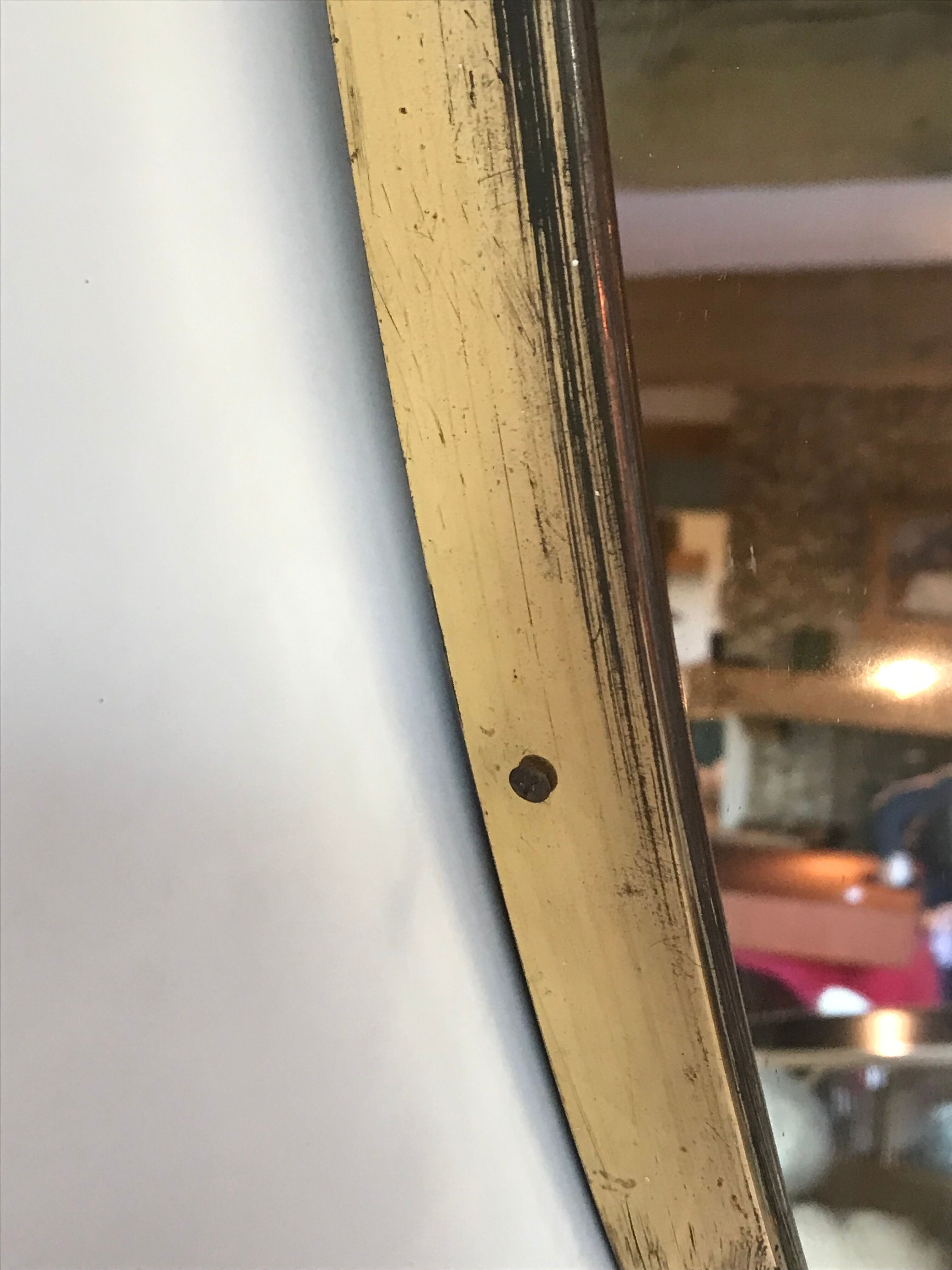 Oval brass mirror, Italy, circa 1960.