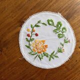 Small white placemat embroidered in colored thread, vintage