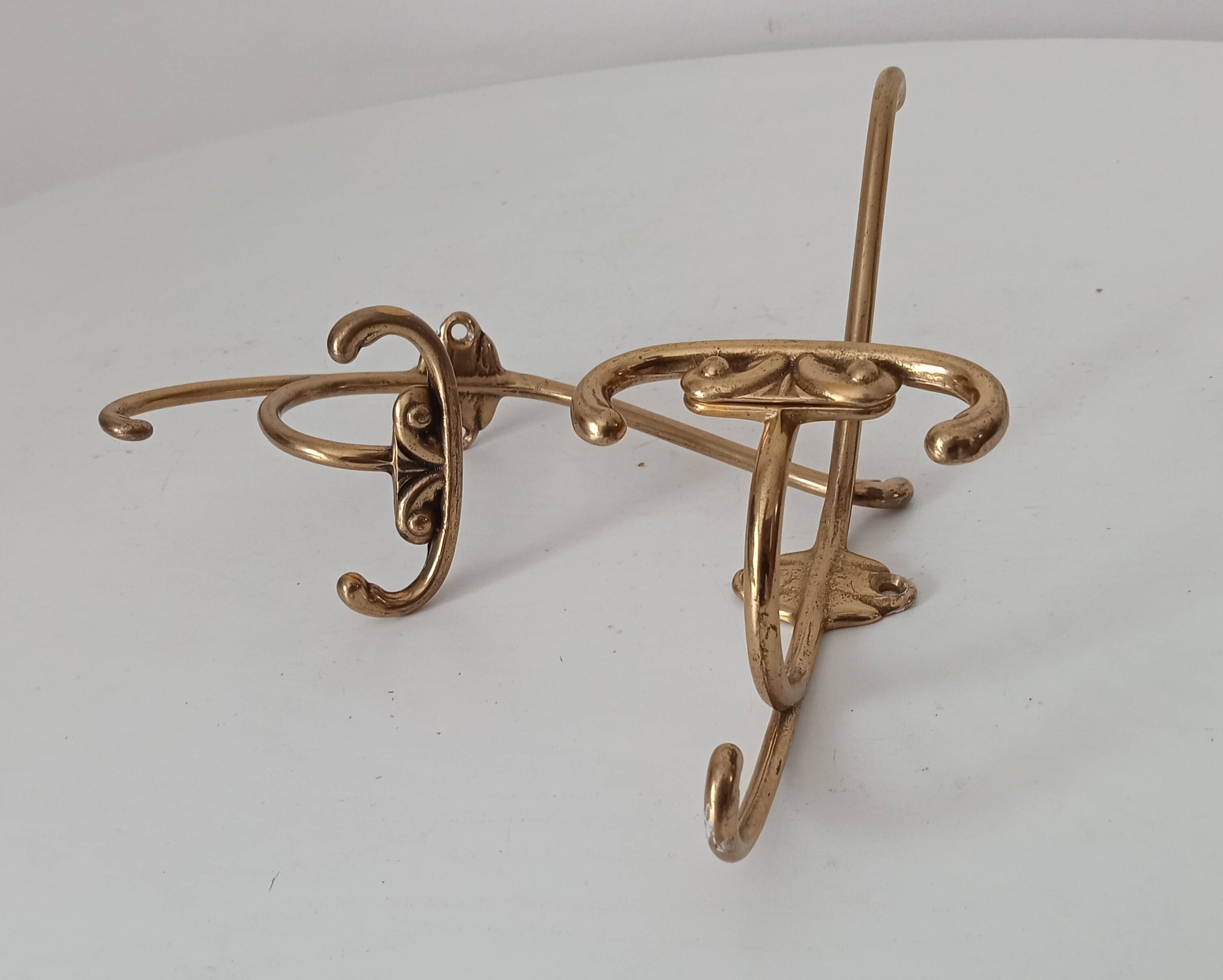 Old coat hook in solid golden brass