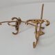 Old coat hook in solid golden brass