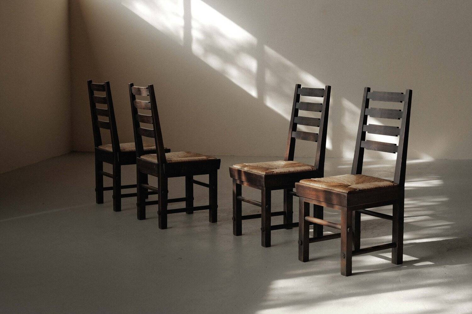 Modernist chairs in oak and woven straw, France, circa 1948