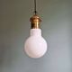 Large bulbous pendant light in white opaline and brass