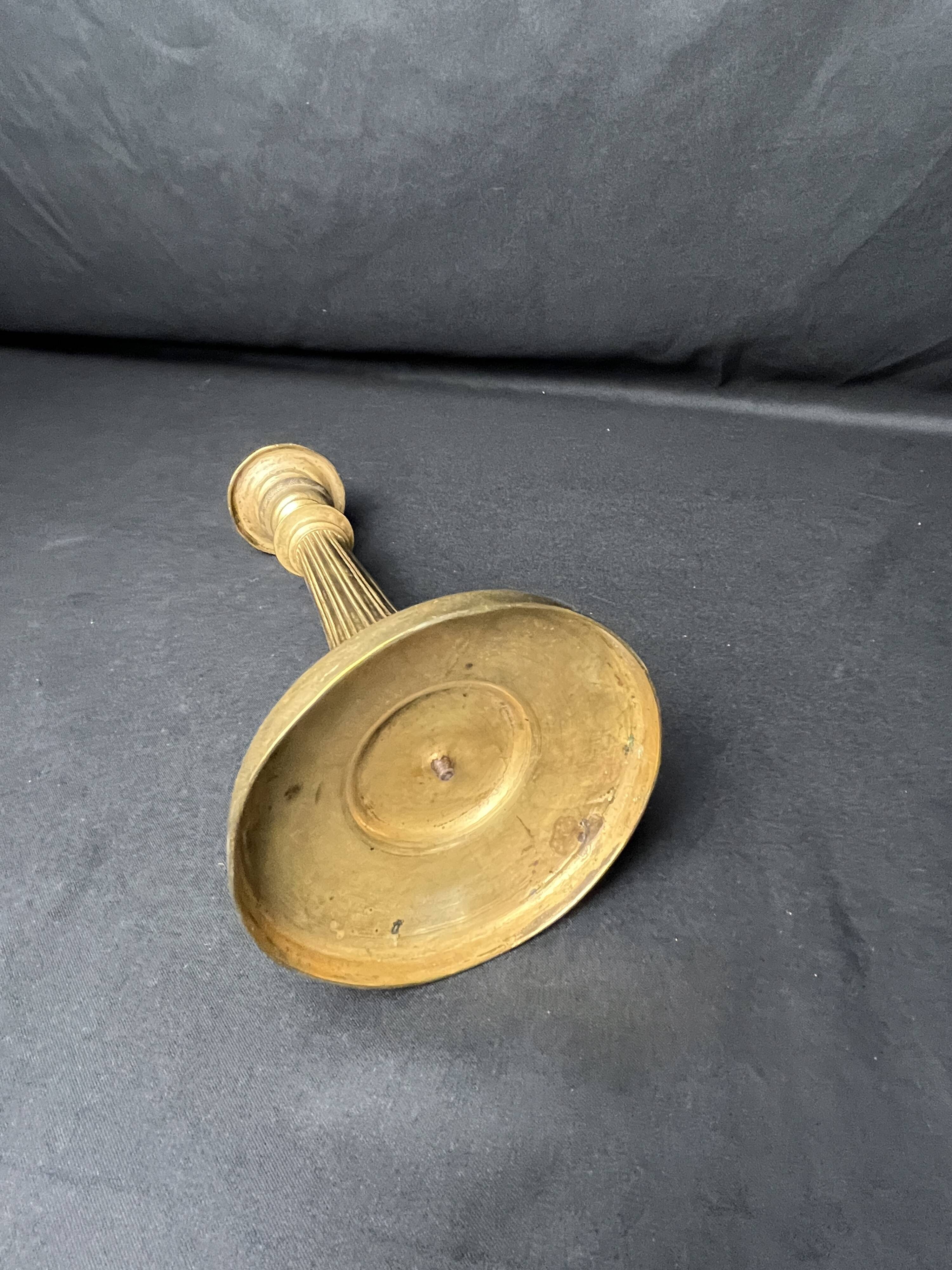 Antique ornate brass torch from the early 20th century