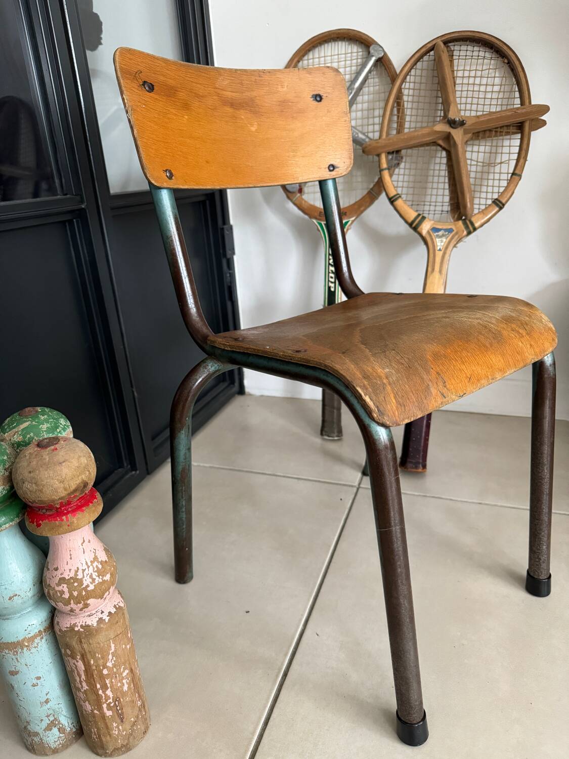 Old wooden and metal children's school chair