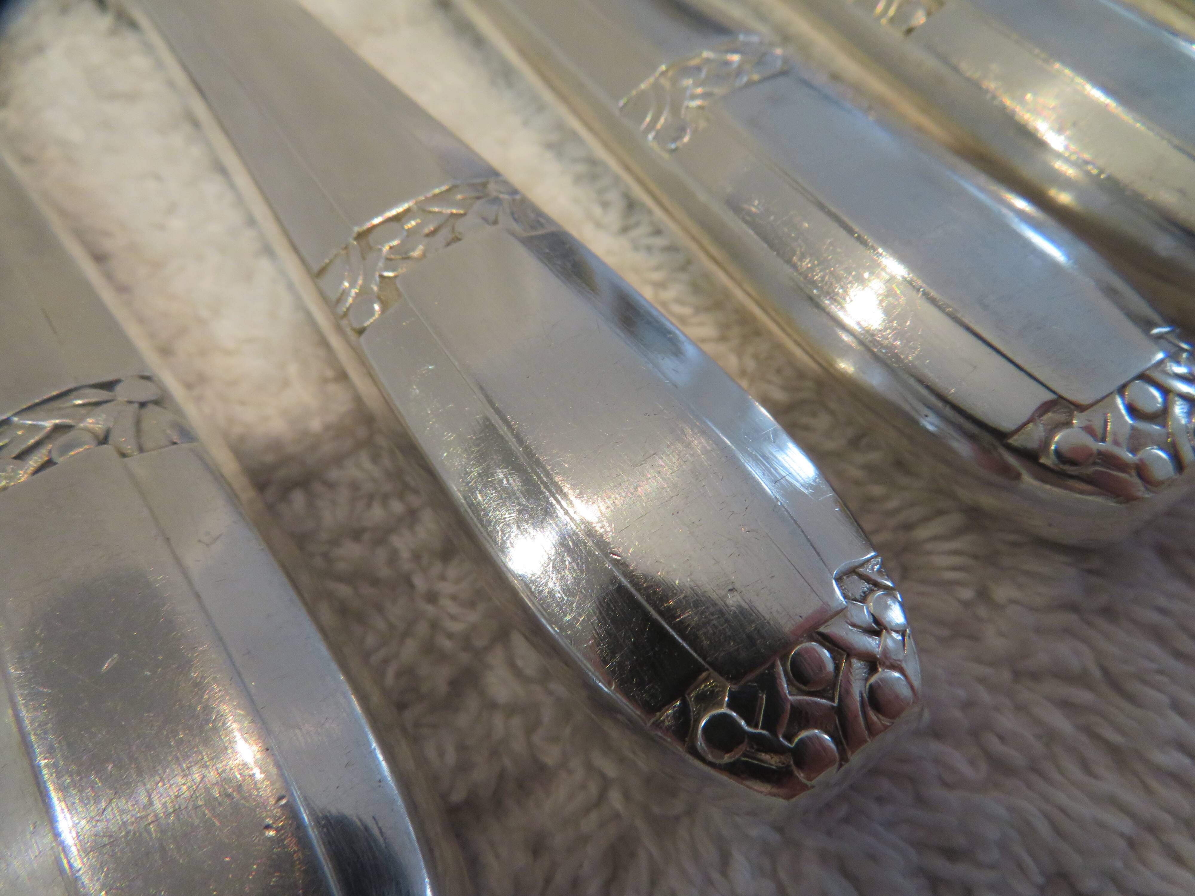 12 silver-plated dessert knives by Argit goldsmith? Art Deco floral bands