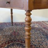 Cherry wood desk with a leather top.