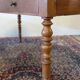 Cherry wood desk with a leather top.