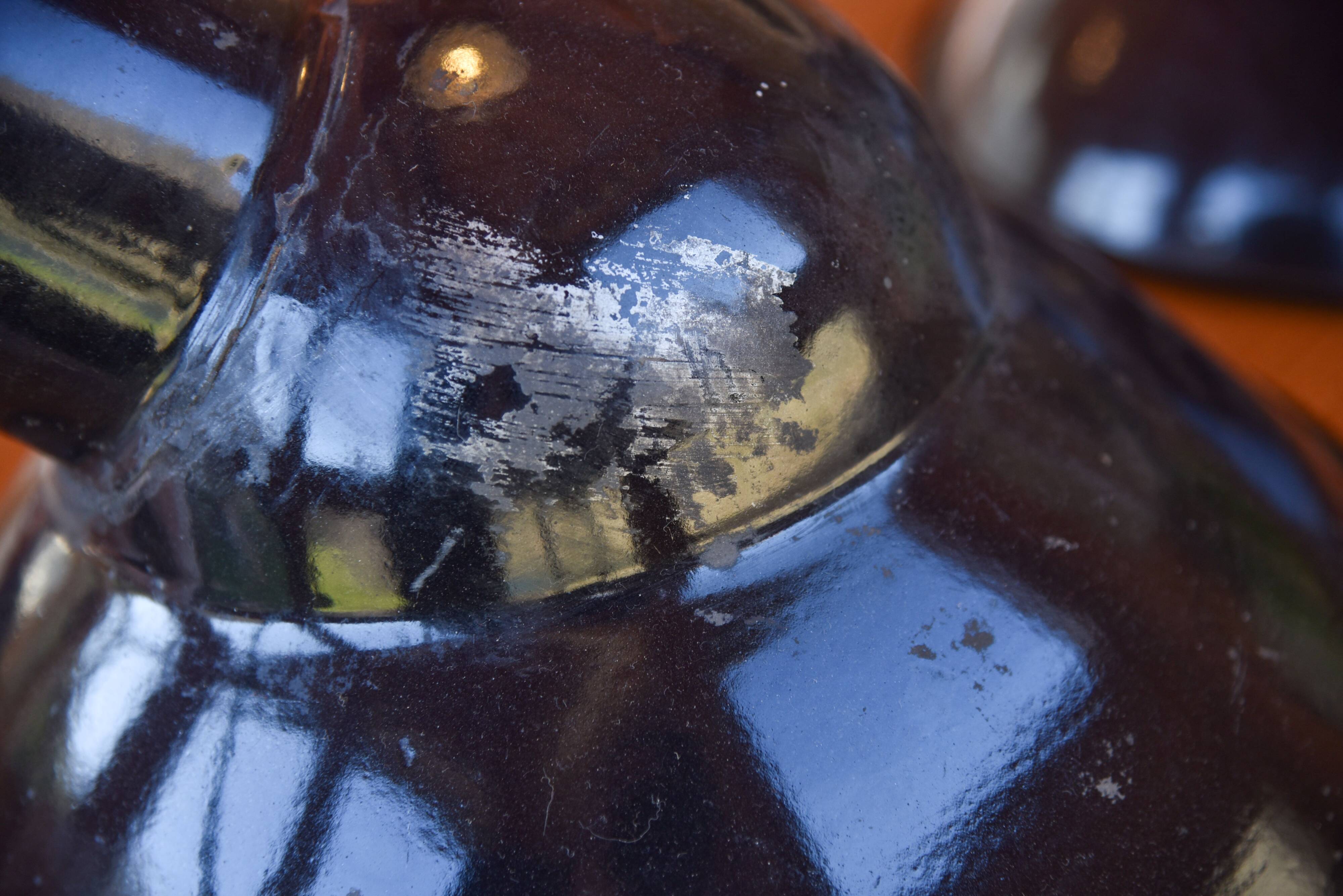 Pair of black enamelled sheet metal pendant lights from the 1950s.