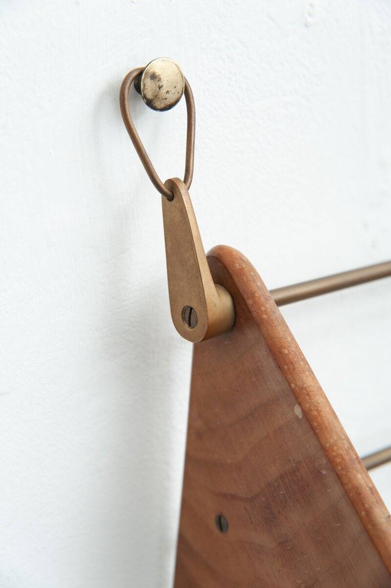 Wall-mounted walnut bookshelf by Carl Auböck, 1950s