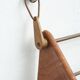 Wall-mounted walnut bookshelf by Carl Auböck, 1950s