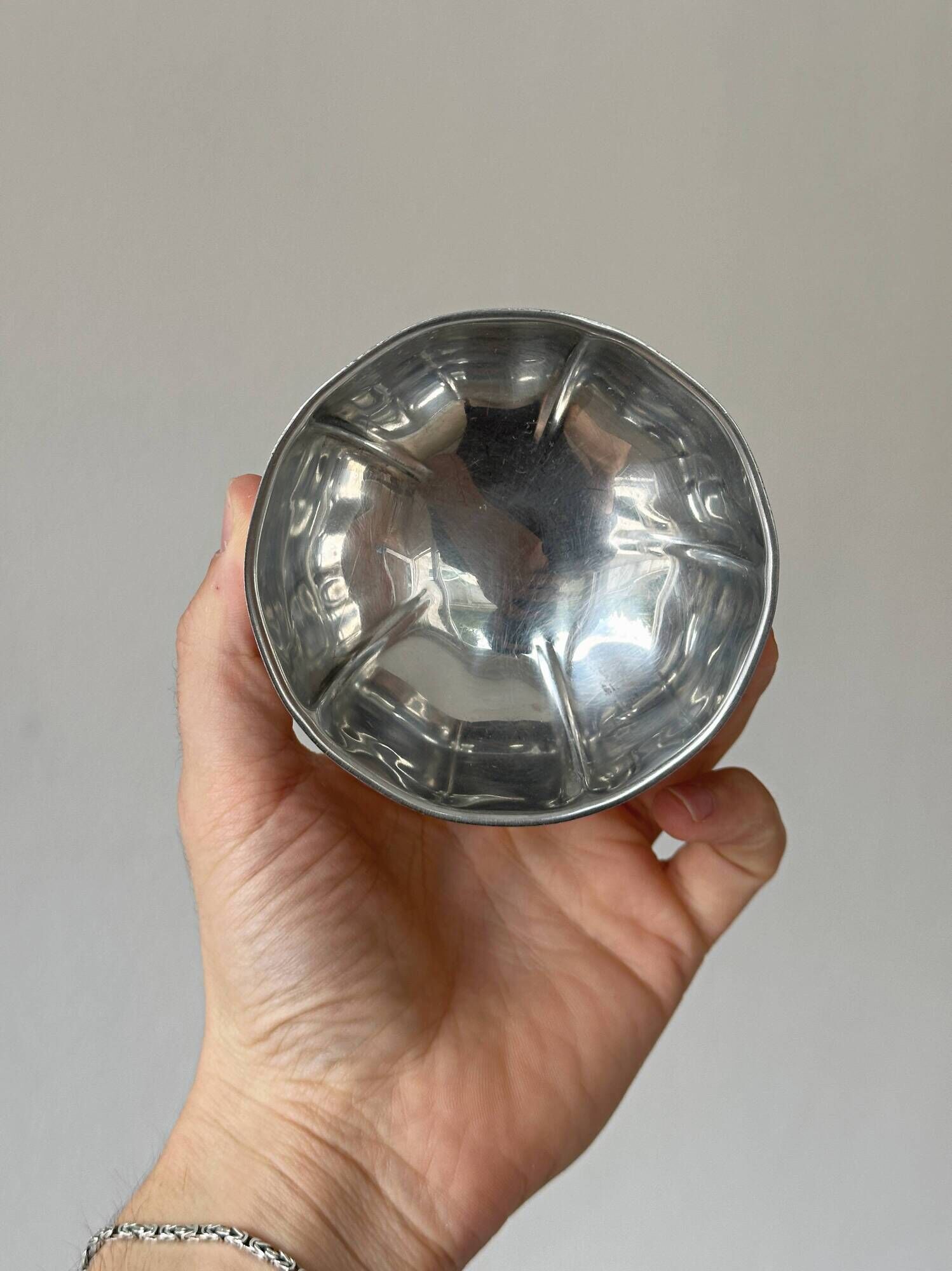 Set of 6 silver stainless steel ice cream bowls on a stand.
